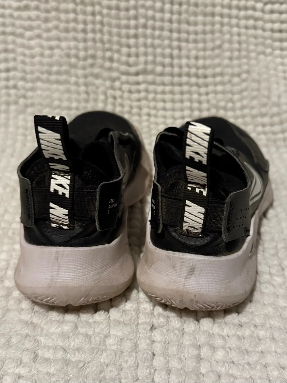 Nike Kids Black Slip-On Sneakers with White Swoosh